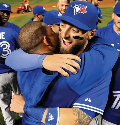  ?? PATRICK SMITH/GETTY IMAGES ?? Kevin Pillar is all smiles after the Blue Jays clinched the AL East division title with a 15-2 victory over the Orioles in Baltimore on Wednesday.