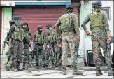  ?? ANI ?? Security personnel inspect a spot after a terrorist attack in Nowgam on Friday.