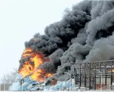  ?? DAVE JOHNSON/WELLAND TRIBUNE ?? Multiple fire services from across Niagara Region provided mutual aid to Port Colborne Fire and Emergency Services as it battled Tuesday’s massive fire at Vinyl Works Canada on Barber Drive in Port Colborne.