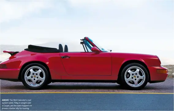  ??  ?? ABOVE The 964 Cabriolet’s roof system adds 70kg in weight over a Coupé, yet the open-topped car proves a better ally for touring