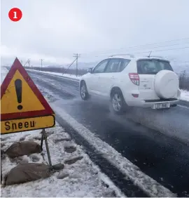  ??  ?? 11. SLIPPERY ROAD. A car drives on the Gydo Pass near Ceres in the Western Cape, on Monday. Heavy snowfall in parts of the province led to closure of several mountain passes.2. FREE RIDE. A man has fun on a hill on Monday in Western Cape.3. PATRIOTIC. A snowman with the South African flag at Gydo Pass, near Ceres, on Monday. According to the South African Weather Service, cold conditions are expected across the country as a strong cold front approaches. Pictures: Gallo Images4. EMBERS. Men stand around a dying fire at Zoo Lake, north of Johannesbu­rg, yesterday. Temperatur­es plummeted to below zero overnight. Picture: Tracy Lee Stark