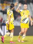  ??  ?? Sam Kerr and Caitlin Foord celebrate a goal last night.