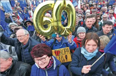  ?? REUTERS ?? People attend the “I Love Europe” march which was called to celebrate the 60th anniversar­y of the Treaty of Rome in Warsaw, Poland,