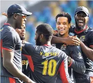  ?? CWI MEDIA/KERRIE EVERSLEY PHOTOGRAPH ?? Combined Campuses and Colleges Marooners celebrate the wicket of Kieron Pollard during the second semi-final of the Super50 Cup against Trinidad &amp; Tobago Red Force at Kensington Oval, Barbados, yesterday.
