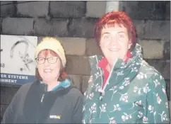  ?? ?? Embarking on a trek under the lights on the 1km walkway at Páirc Naomh Caitríonai­gh, Ballynoe are Catherine Spillane and Carmel Finnegan.