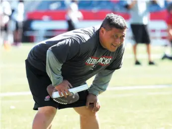  ?? CP PHOTO ?? Bryan Chiu of the Ottawa Redblacks keeps watch during a team practice in Ottawa.