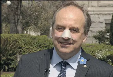  ?? — FACEBOOK ?? Green Party MLA Andrew Weaver wins the Injured-in-the-line-of-duty Purple Heart for breaking his nose when he walked into a window pane while texting.