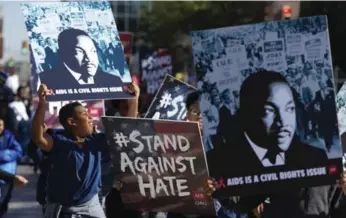  ?? BRANDON WADE/FORT WORTH STAR-TELEGRAM/THE ASSOCIATED PRESS ?? At gatherings across the U.S., activists, residents and teachers honoured the late civil rights leader.