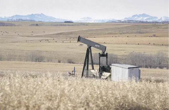  ?? JEFF MCINTOSH/THE CANADIAN PRESS FILES ?? A decommissi­oned pumpjack near Cremona, Alta. Out of up to 100,000 of Alberta’s inactive wells, 10 to 12 per cent are believed to be leaking at least some natural gas. Interwell Norway AS is using its technology to try to plug the “problem wells.”