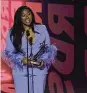  ?? CHRIS PIZZELLO | AP ?? Jazmine Sullivan accepts the award for best female R&B/pop artist at the BET Awards on Sunday at the Microsoft Theater in Los Angeles.