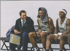  ?? Submitted photo ?? NEW HEAD NIGHTHAWK: National Park’s Dillon Hargrove, left, laughs with Terry Clardy Jr. while sitting on the bench in the Nighthawks’ hope opener against UA Cossatot on Nov. 12, 2019. Hargrove was named the Nighthawks men’s head coach on Monday after two years as the team’s assistant coach. Photo courtesy of Aaron Brewer