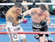  ?? Picture: ETHAN MILLER/GETTY IMAGES/AFP ?? MOVING IN: Canelo Alvarez throws a right at Gennady Golovkin in the fifth round of their WBC/WBA middleweig­ht title fight at the T-Mobile Arena in Las Vegas, Nevada