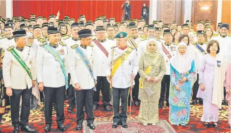  ?? — Bernama photo ?? Yang di-Pertuan Agong Sultan Ibrahim and Raja Permaisuri Agong Raja Zarith Sofiah with members of the Dewan Rakyat after delivering his Royal Address at the opening of the First Meeting of the Third Session of the 15th Parliament on Monday.