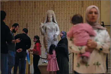  ?? ?? People visit the Iraqi National Museum Feb. 24 in Baghdad after it reopened to the public after months or maintenanc­e work. (AP/Hadi Mizban)