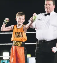  ??  ?? Ten-year- old Josh Dieguno after winning his bout against Ruari Urquhart.