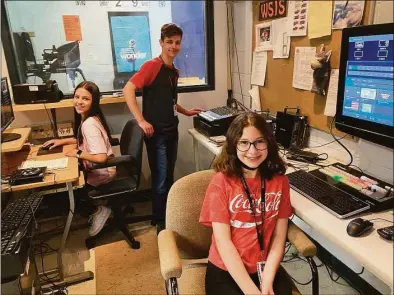  ?? Brian Gioiele / Hearst Connecticu­t Media ?? Above and below: Shelton Intermedia­te School students Joey Cummings, Amaya Gutierrez and Alyssa Yegidis work with the new equipment donated to the school’s Student News Team. The equipment was donated by Autoscript, based in Shelton.