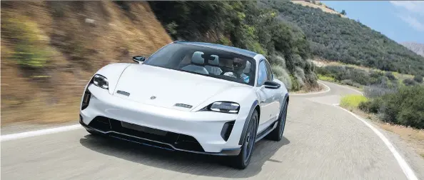  ?? PHOTOS: PORSCHE ?? Porsche claims 600 PS (about 590 horsepower) from the Mission E’s twin synchronou­s electric motor, making it very fast as it hugs the road.