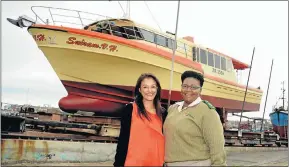  ??  ?? RAGS TO RICHES: Businesswo­man Sharmilla van Heerden, left, stands in front of her newly refurbishe­d shark long-liner, Suiram VH. Originally built in Perth, Australia, for tuna fishing, it will be launched shortly from the slipway in the Port Elizabeth...