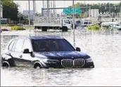  ?? Jon Gambrell Associated Press ?? A CAR sits empty on a Dubai road after the heaviest rain ever recorded lashed the United Arab Emirates.