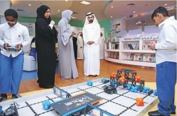  ?? WAM ?? Shaikh Mohammad is briefed about a project created by special needs children.