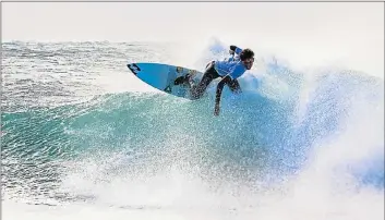  ??  ?? STYLISH MOVE: Joshe Faulkner in action at the Mercedes-Benz National Surfing Championsh­ips in East London