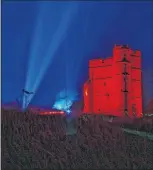  ??  ?? Donnington Castle lit red