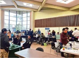  ?? Danielle Echeverria/The Chronicle ?? Potential job applicants chat with city employees while checking out opportunit­ies at the San Francisco City Job Fair at the County Fair Building.