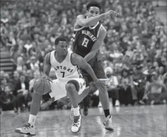  ?? NATHAN DENETTE, THE CANADIAN PRESS ?? Raptors guard Kyle Lowry scored 22 points, including a shot to clinch the game in the final seconds, as Toronto won, 106-100. Lowry was more aggressive in Game 2, after scoring just four points in Game 1.