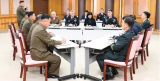  ?? (Yonhap/Reuters) ?? UNITED NATIONS Command, South Korean and North Korean military officers meet yesterday in the Demilitari­zed Zone of South Korea.