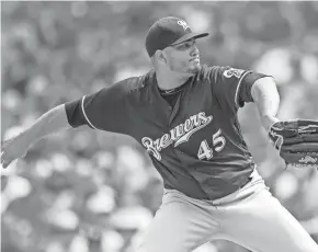  ?? PATRICK GORSKI / USA TODAY SPORTS ?? Brewers starter Jhoulys Chacín allows three hits and strikes out 10 in seven innings against the Chicago Cubs on Tuesday.