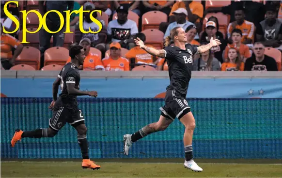  ?? AP FILE PHOTO ?? Vancouver Whitecaps player Brek Shea, right, celebrates with Yordi Reyna, left, after scoring a goal along during the second half of a game against the Houston Dynamo in Houston on March 10.