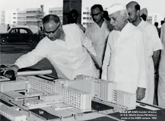  ?? Photo by NEHRU MEMORIAL LIBRARY ?? SCALE UP AIIMS founder-director Dr B.B. Dikshit shows PM Nehru a model of the AIIMS campus, 1956