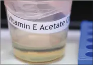  ?? HANS PENNINK - ASSOCIATED PRESS ?? This Nov. 4 photo shows a vitamin E acetate sample during a tour of the Medical Marijuana Laboratory of Organic and Analytical Chemistry at the Wadsworth Center in Albany, N.Y. On Friday, the Centers for Disease Control and Prevention in Atlanta said fluid extracted from 29 lung injury patients who vaped contained the chemical compound in all of them.