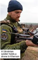  ?? ?? A Ukrainian soldier holds a drone in Kherson