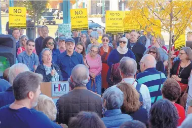  ?? GREG SORBER/JOURNAL ?? Rabbi Deborah Brin, left, with microphone, and Rabbi Paul Citrin, right, lead a prayer during Sunday’s rally at the Holocaust &amp; Intoleranc­e Museum of New Mexico for the victims of the Pittsburgh synagogue mass shooting. About 200 people attended the event, including speakers Albuquerqu­e first lady Elizabeth Kistin Keller, Vincent Gatlin of Fellowship Missionary Baptist Church and Everett Chavez, former governor for Santo Domingo Pueblo.