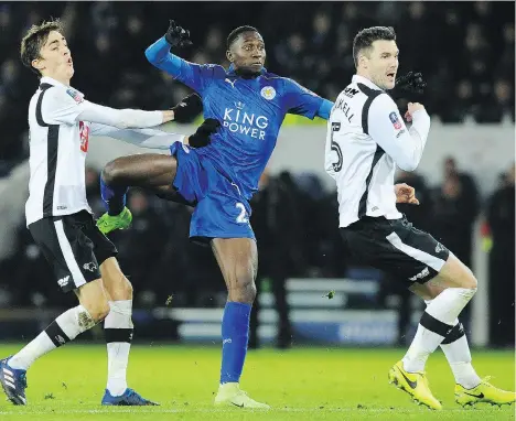  ?? RUI VIEIRA/ THE ASSOCIATED PRESS ?? Leicester’s Wilfred Ndidi, centre, scored in a big 3-1 English FA Cup victory Wednesday against Derby County that gave the defending Premier League champions a boost of confidence as they head into the stretch run hoping to avoid relegation.