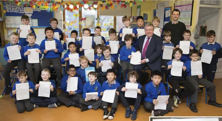  ??  ?? Mr Donohoe’s third class pupils present their persuasive letters to Cllr Joe Behan at St Cronan’s NS.