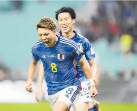  ?? Photo/ AP ?? Japan’s Ritsu Doan celebrates after scoring his side’s opening goal against Germany at the Khalifa Internatio­nal Stadium.