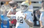  ?? CHUCK BURTON — THE ASSOCIATED PRESS ?? Notre Dame’s Ian Book had a productive day at quarterbac­k, passing for two TDs and running for three.