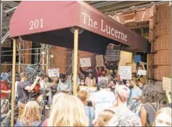  ??  ?? Protest at Lucerne hotel backing homeless men who want to stay put. Three of homeless joined suit seeking to overturn judge’s relocation OK.