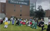  ?? KATHLEEN E. CAREY — MEDIANEWS GROUP ?? Crozer-Chester Medical Center physicians and nurses kneel Friday in conjunctio­n with White Coats 4 Black Lives.