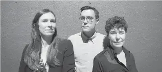  ??  ?? B.C. Civil Liberties Associatio­n litigation director Grace Pastine, left, executive director Josh Paterson and policy director Micheal Vonn outside their offices in Vancouver.