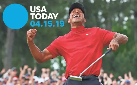  ?? ROB SCHUMACHER/USA TODAY SPORTS ?? Tiger Woods seals the win Sunday with a putt on the 18th green of Augusta for his fifth Masters championsh­ip – and his first in 14 years.