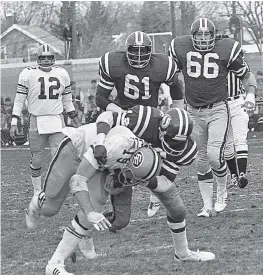  ??  ?? Saskatchew­an’s George Wells tackles Calvin Harrell, with Jesse O’Neal, directly behind, and Tim Roth, right, providing backup. Tom Wilkinson is in the background.