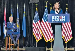  ?? AFP ?? Democratic presidenti­al candidate Joe Biden looks on as his running mate Kamala Harris speaks during an event in Wilmington, Delaware, on Thursday.