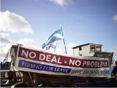  ??  ?? A boat in North Shields is adorned with slogans ahead of the Fishing for Leave flotilla in March (Getty)