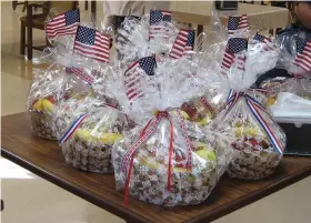  ?? (Special to The Commercial) ?? The White Hall American Legion Post 232 is active in the community and supports a number of causes through the money it raises at the White Hall citywide Trade Days, like this donation of fruit-gift baskets to a local nursing home.