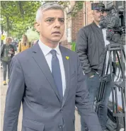  ?? AFP ?? Mayor of London Sadiq Khan arrives for a service of remembranc­e for the Grenfell tower fire at St Helen’s church in west London on Friday.