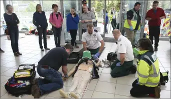  ??  ?? Doctors, Community First Responders and paramedics show how they treat a suspected heart attack.