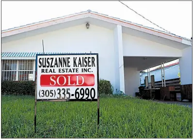  ?? AP ?? Freddie Mac reported little change this week for long-term mortgage rates on properties such as this home in Surfside, Fla., shown in April.